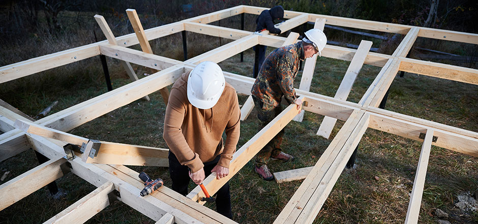 Three Men Constructing Deck Joists