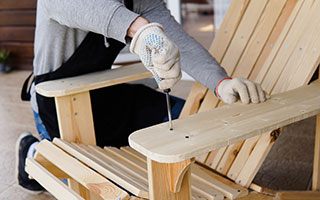 Man Building Wood Adirondack Chair