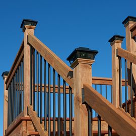 Cedar Tone Wood Stair Railing with Black Aluminum Post Caps
