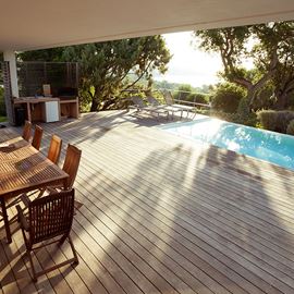 Wood Deck by Pool with Chairs and Table