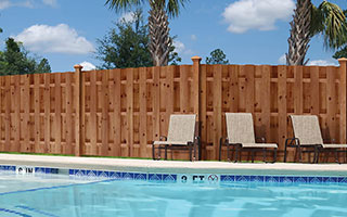 Shadowbox Privacy ProWood Color-Treated wood fence surrounding pool