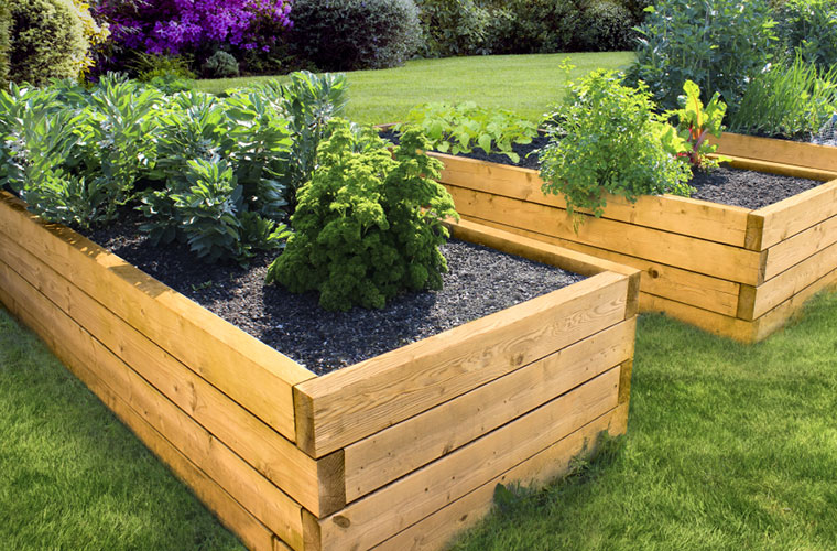 Garden bed made of pressure-treated wood in cedar tone