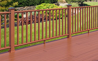 ProWood pressure treated routed wood railing and 2x2 SE wood balusters in Redwood Tone